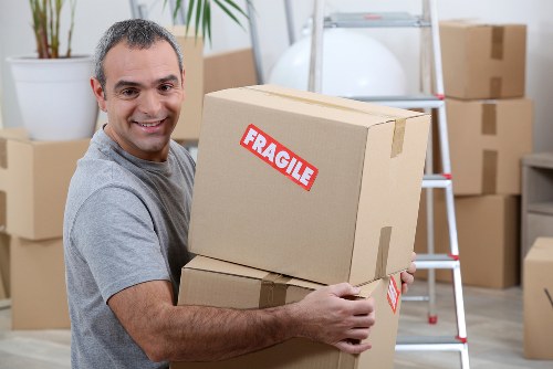 Professional removals team preparing items near a Haringey property