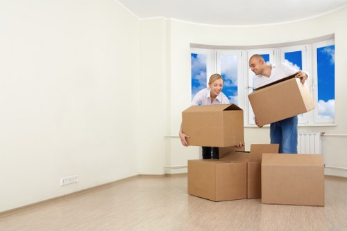 Moving team handling furniture outside a Haringey property