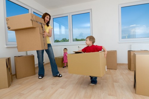 Professional movers carrying furniture during a residential relocation in Haringey