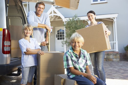 Supervisors reviewing a safe loading process before a house move