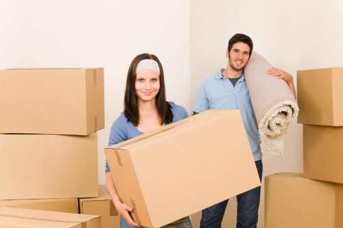 Prepared moving boxes and furniture ready for removal truck hire